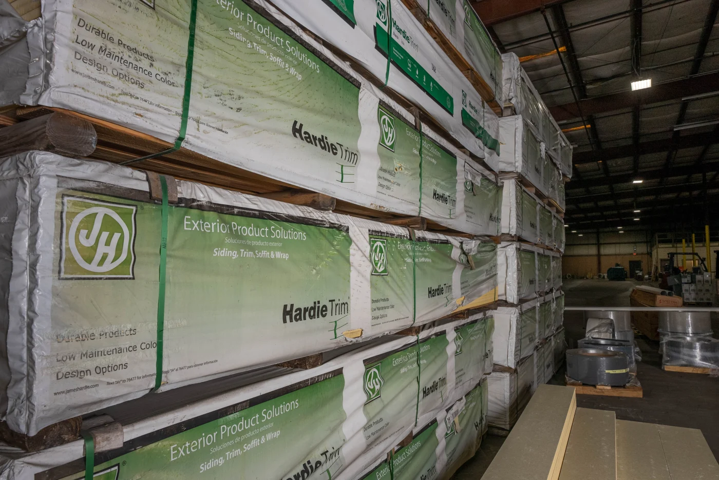 Crew installing James Hardie fiber cement siding