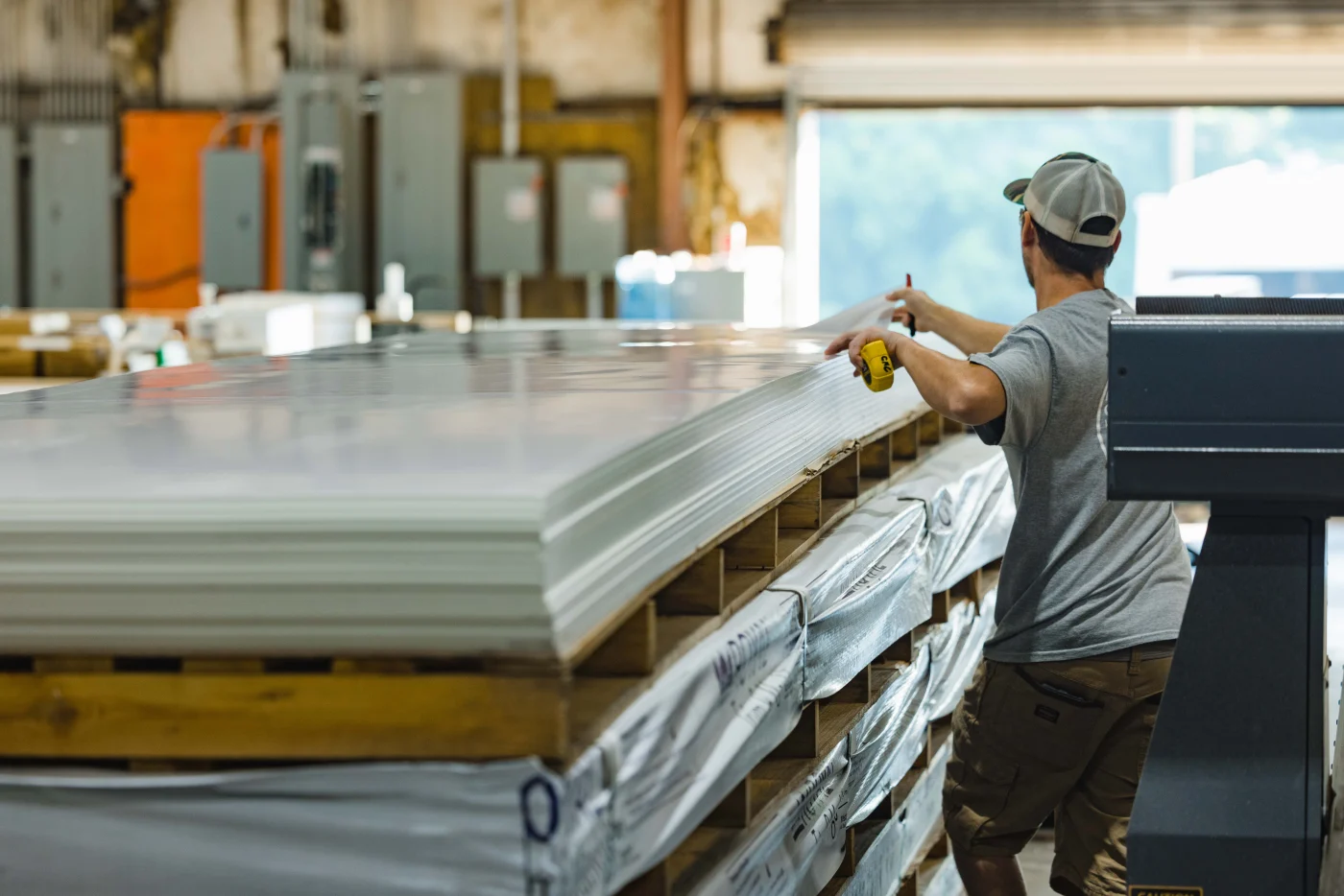 Project manager inspecting completed exterior work with homeowner